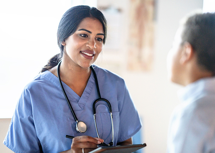 International nurse speaking to a patient