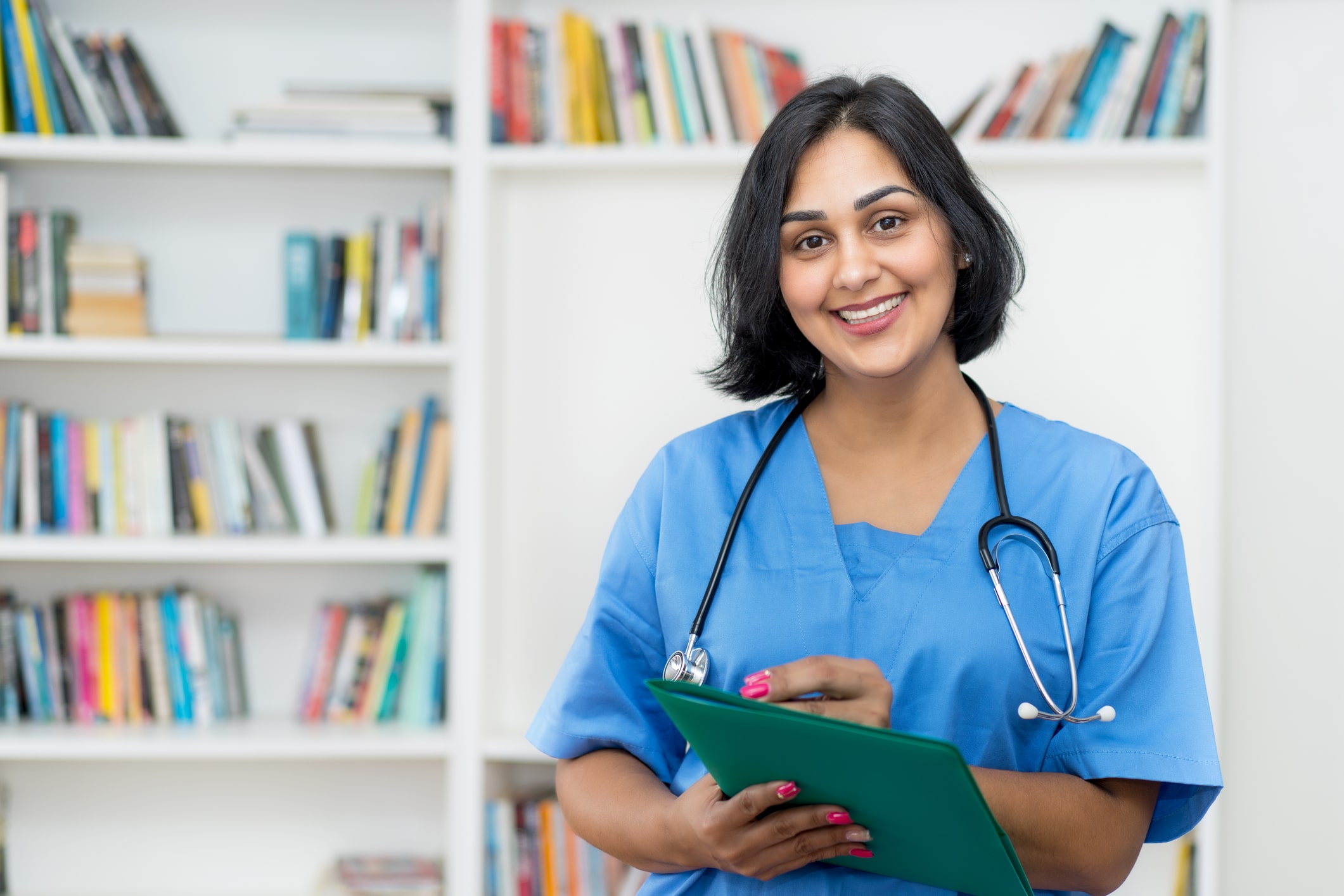 Nurse smiling holding patient file